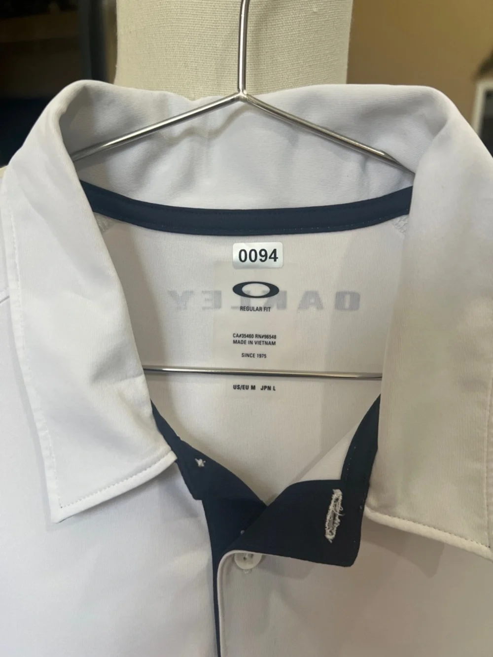 Oakley White Polo with Navy Trim - Picture 1 of 5